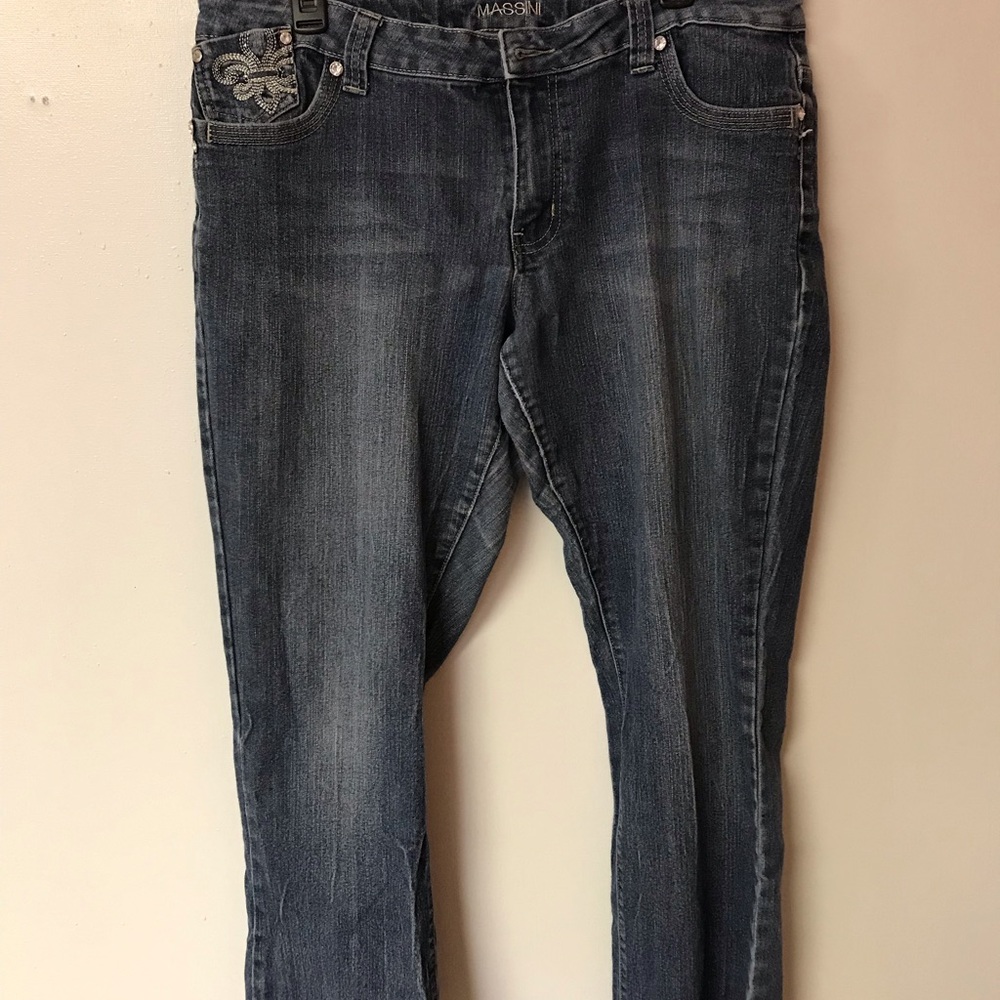 Dark wash jeans with fluer de lis detail